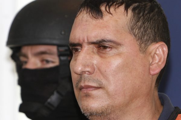 Soldiers present to the press Noel Salgueiro Nevarez, alias "El Flaco Salgueiro," alleged member of the Sinaloa criminal organization led by Joaquin Guzman Loera, alias "El Chapo Guzman," in Mexico City, Wednesday Oct. 5, 2011.  Authorities allege Salgueiro is the leader of "Gente Nueva," or "New People," a criminal organization allied with El Chapo Guzman.  Salgueiro was arrested on Tuesday in the northern city of Culiacan, Sinaloa state, according to the army. (AP Photo/Marco Ugarte)